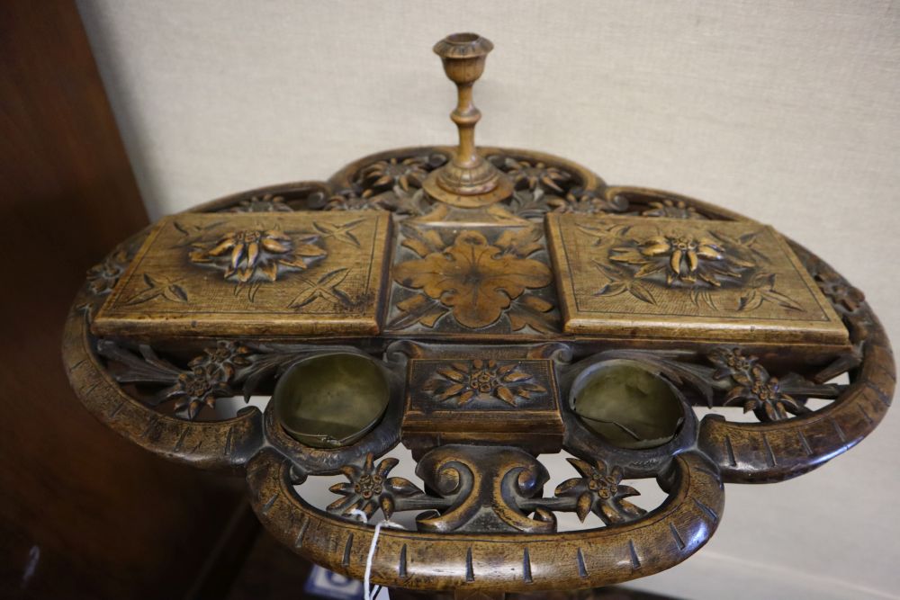 A 19th century Alpine carved fruitwood smokers compendium,